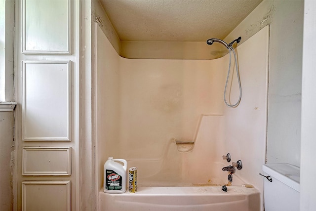 25107 Broughton St, Spring, TX 77373 - full bath with shower / tub combination and a textured ceiling