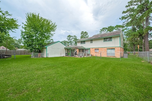 25107 Broughton St, Spring, TX 77373 - rear view of property with a fenced backyard and brick siding