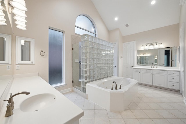 15411 Driftwood Oak Ct, Houston, TX 77059 - bathroom featuring a stall shower, tile patterned flooring, two vanities, a bath, and high vaulted ceiling