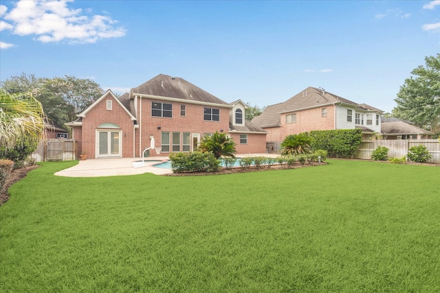 15411 Driftwood Oak Ct, Houston, TX 77059 - rear view of house featuring a fenced backyard, a patio, brick siding, and french doors