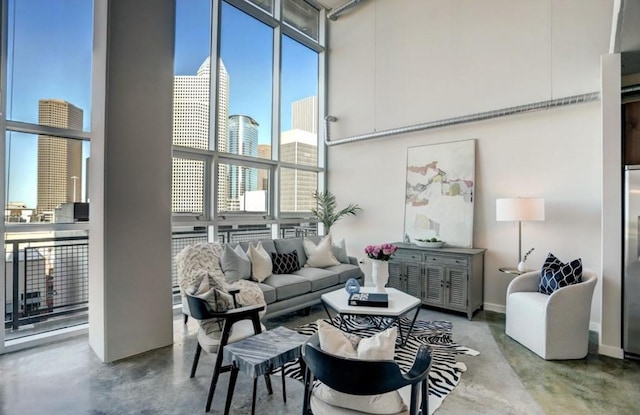 2000 Bagby St Unit 9420, Houston, TX 77002 - living room with finished concrete flooring and a towering ceiling
