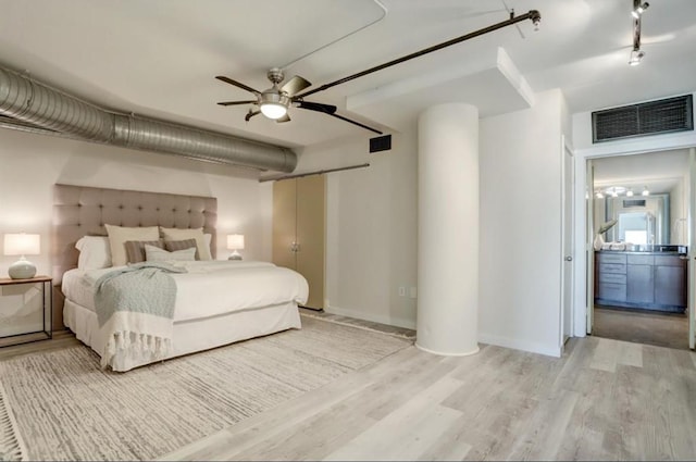 2000 Bagby St Unit 9420, Houston, TX 77002 - bedroom featuring light wood-style flooring and baseboards