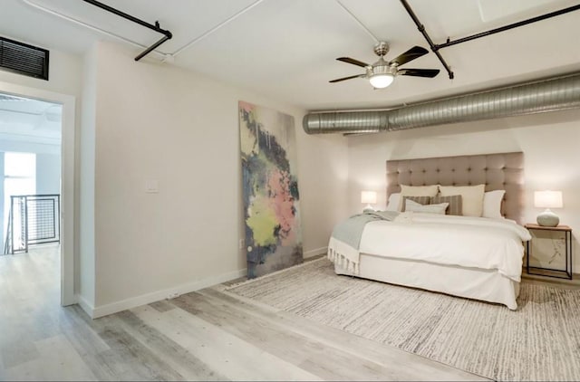 2000 Bagby St Unit 9420, Houston, TX 77002 - bedroom featuring wood finished floors and ceiling fan