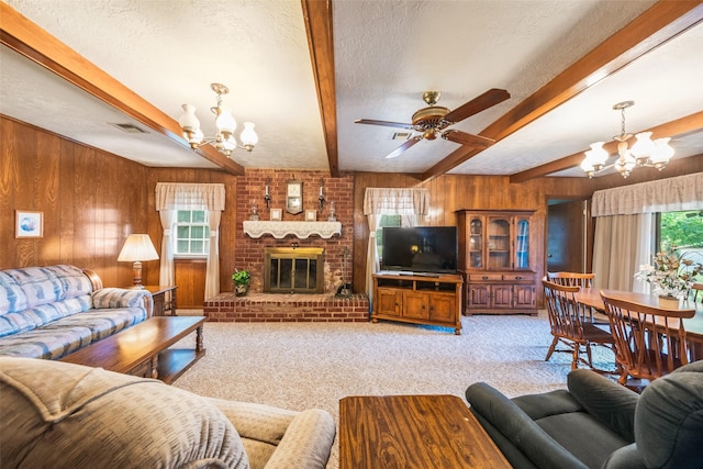 91 E Post Oak Ln, Shepherd, TX 77371 - living room with a chandelier, wooden walls, beamed ceiling, light colored carpet, and healthy amount of natural light