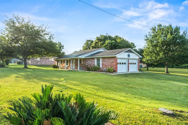91 E Post Oak Ln, Shepherd, TX 77371 - view of front facade featuring brick siding, covered porch, a front yard, and a garage