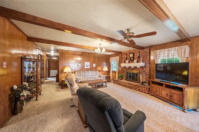 91 E Post Oak Ln, Shepherd, TX 77371 - living room with carpet floors, wood walls, beam ceiling, a textured ceiling, and ceiling fan