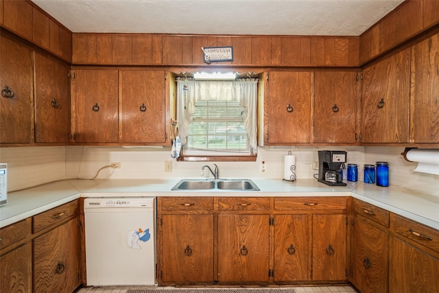 91 E Post Oak Ln, Shepherd, TX 77371 - kitchen featuring white dishwasher, light countertops, brown cabinetry, and a textured ceiling