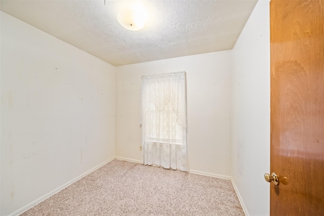 91 E Post Oak Ln, Shepherd, TX 77371 - unfurnished room featuring carpet flooring and a textured ceiling