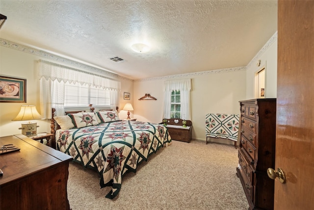 91 E Post Oak Ln, Shepherd, TX 77371 - carpeted bedroom featuring a textured ceiling