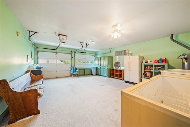 91 E Post Oak Ln, Shepherd, TX 77371 - garage featuring freestanding refrigerator and a garage door opener