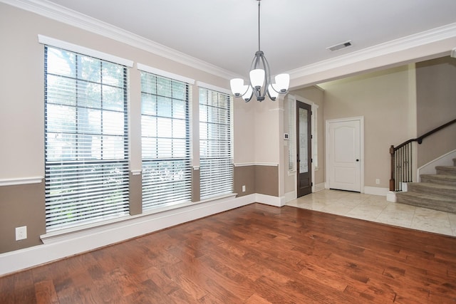 6034 Gracys Landing Ln, Katy, TX 77494 - spare room with a chandelier, ornamental molding, wood finished floors, and stairs
