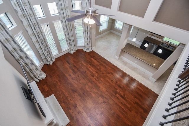 6034 Gracys Landing Ln, Katy, TX 77494 - unfurnished living room with a ceiling fan and wood finished floors