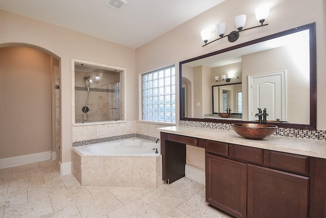 6034 Gracys Landing Ln, Katy, TX 77494 - full bath with a stall shower, a bath, vanity, backsplash, and tile patterned floors