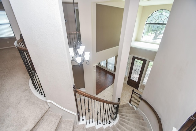 6034 Gracys Landing Ln, Katy, TX 77494 - entrance foyer with a chandelier, healthy amount of natural light, stairs, a towering ceiling, and carpet