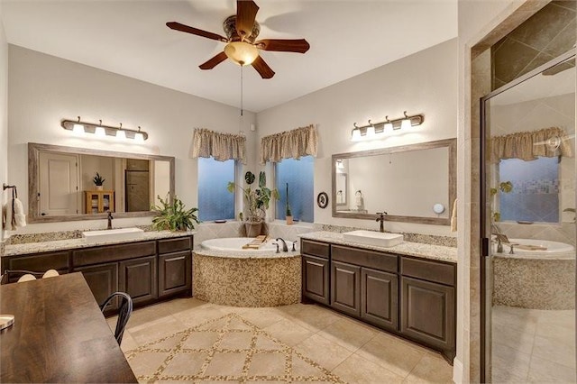 10210 Grape Creek Grove Ln, Cypress, TX 77433 - full bathroom featuring tile patterned flooring, a bath, a ceiling fan, and two vanities
