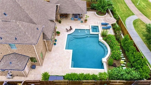 10210 Grape Creek Grove Ln, Cypress, TX 77433 - view of swimming pool featuring a fenced backyard, a patio, and exterior bar