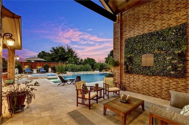 10210 Grape Creek Grove Ln, Cypress, TX 77433 - pool at dusk featuring a fenced backyard and a patio area