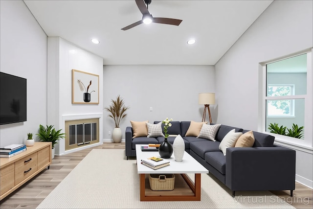10260 Field Stone Dr, Houston, TX 77041 - living room with light wood-type flooring, ceiling fan, and recessed lighting