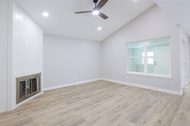 10260 Field Stone Dr, Houston, TX 77041 - unfurnished living room with lofted ceiling, a ceiling fan, a large fireplace, light wood-style floors, and recessed lighting