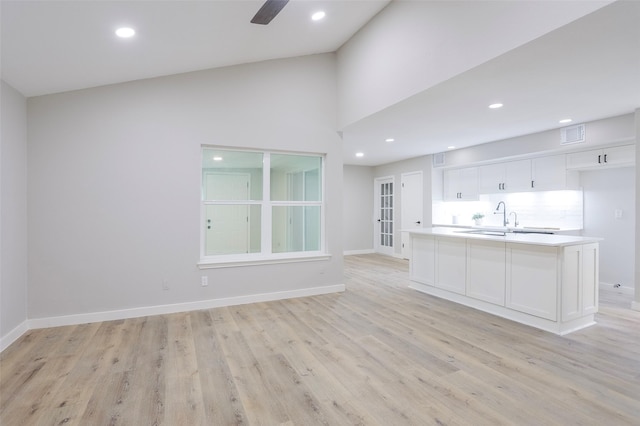 10260 Field Stone Dr, Houston, TX 77041 - unfurnished living room featuring light wood-style floors, ceiling fan, recessed lighting, and a high ceiling
