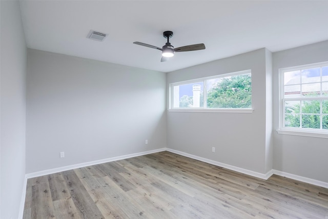 10260 Field Stone Dr, Houston, TX 77041 - empty room with wood finished floors, plenty of natural light, and a ceiling fan