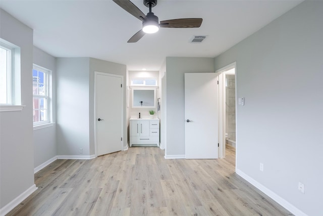 10260 Field Stone Dr, Houston, TX 77041 - unfurnished bedroom featuring light wood-style floors, connected bathroom, and a ceiling fan