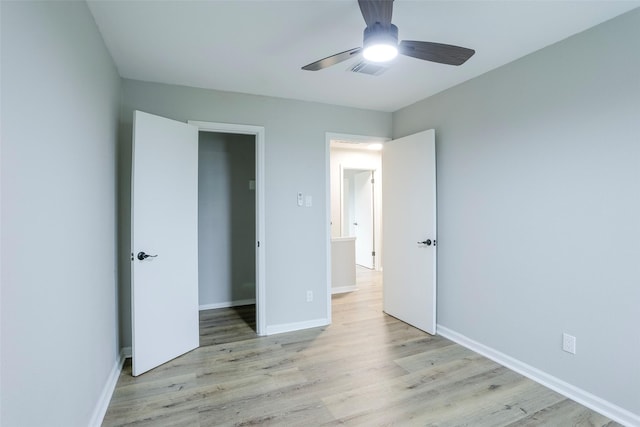 10260 Field Stone Dr, Houston, TX 77041 - unfurnished bedroom with light wood-type flooring and a ceiling fan