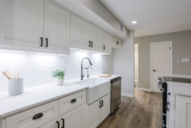 10260 Field Stone Dr, Houston, TX 77041 - kitchen with range with electric stovetop, dishwasher, backsplash, wood finished floors, and white cabinets