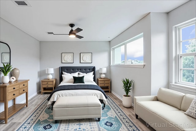 10260 Field Stone Dr, Houston, TX 77041 - bedroom featuring multiple windows, light wood-style flooring, and a ceiling fan