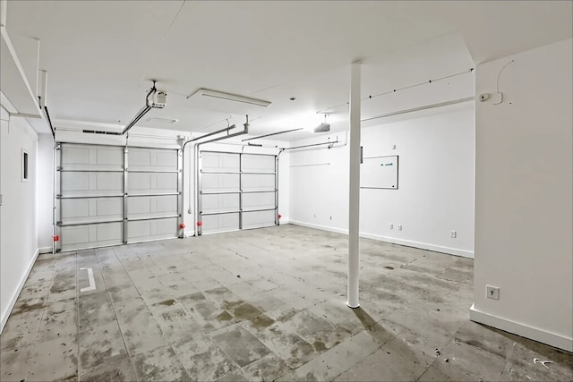 10260 Field Stone Dr, Houston, TX 77041 - garage with a garage door opener and baseboards