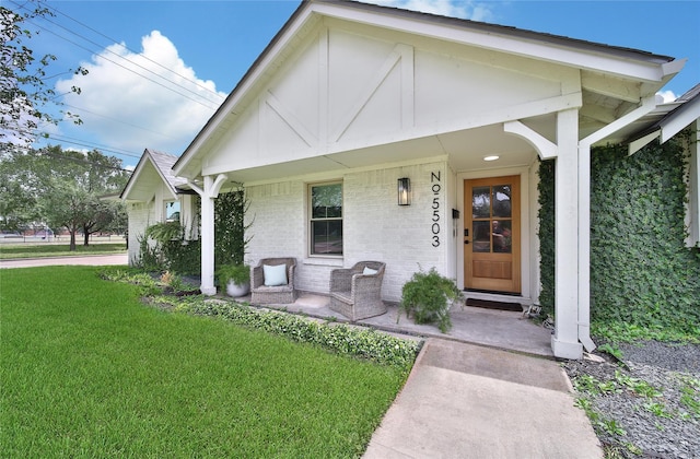 5503 Cheshire Ln, Houston, TX 77092 - view of front of home featuring a porch, brick siding, and a front yard