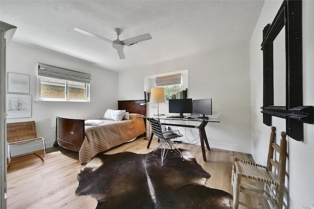 5503 Cheshire Ln, Houston, TX 77092 - bedroom with wood finished floors, a desk, and ceiling fan
