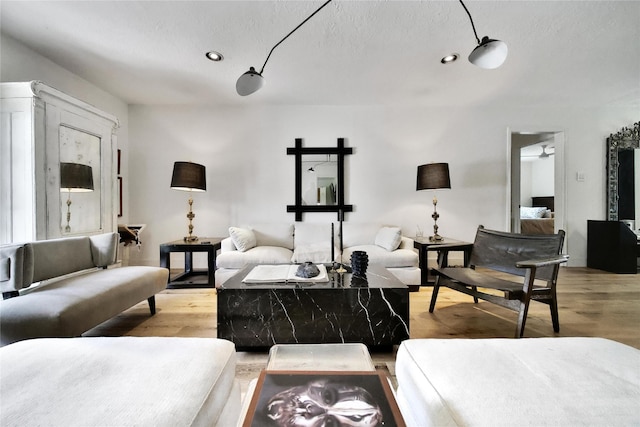 5503 Cheshire Ln, Houston, TX 77092 - living area with light wood-type flooring, recessed lighting, and a textured ceiling