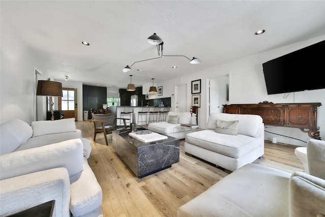 5503 Cheshire Ln, Houston, TX 77092 - living room with light wood finished floors and recessed lighting