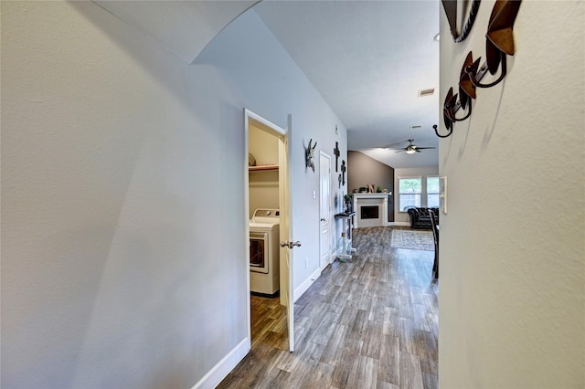 5311 Persimmon Pass, Richmond, TX 77407 - corridor with washer / clothes dryer and wood finished floors