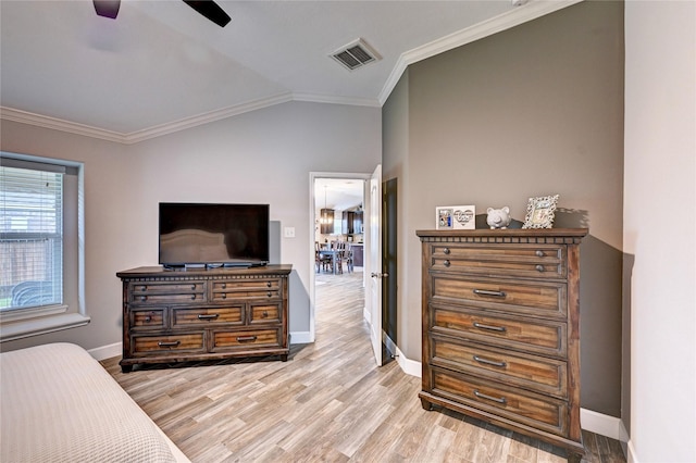 5311 Persimmon Pass, Richmond, TX 77407 - bedroom with ornamental molding, light wood finished floors, lofted ceiling, and ceiling fan