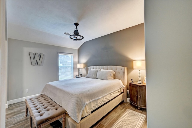 5311 Persimmon Pass, Richmond, TX 77407 - bedroom featuring wood finished floors and vaulted ceiling