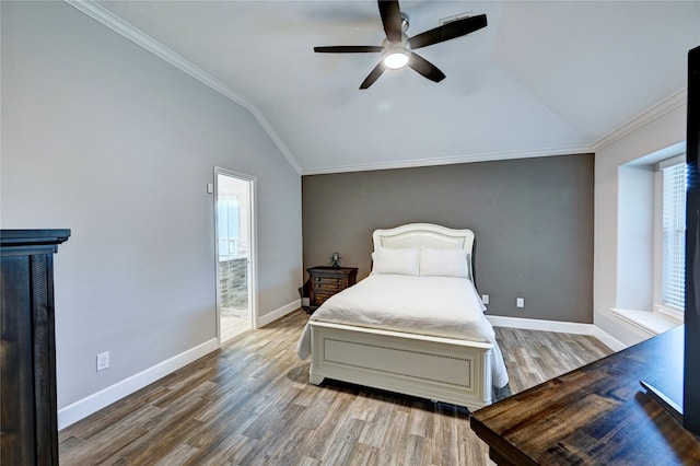 5311 Persimmon Pass, Richmond, TX 77407 - bedroom with wood finished floors, vaulted ceiling, crown molding, a ceiling fan, and ensuite bath