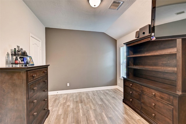 5311 Persimmon Pass, Richmond, TX 77407 - unfurnished bedroom featuring light wood finished floors and lofted ceiling