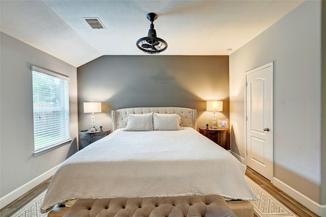 5311 Persimmon Pass, Richmond, TX 77407 - bedroom featuring wood finished floors and vaulted ceiling