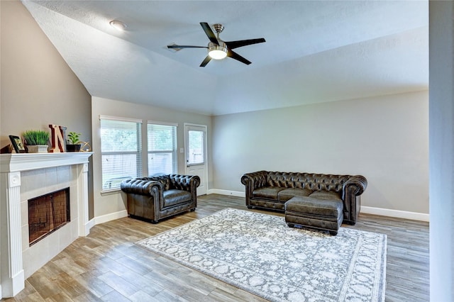 5311 Persimmon Pass, Richmond, TX 77407 - living area with ceiling fan, a fireplace, wood finished floors, and lofted ceiling