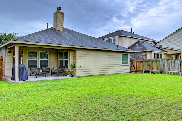 5311 Persimmon Pass, Richmond, TX 77407 - rear view of property with a patio area, a shingled roof, and a chimney