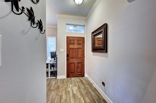 5311 Persimmon Pass, Richmond, TX 77407 - entryway featuring ornamental molding and light wood-type flooring