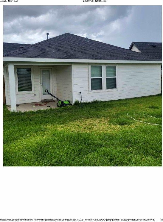 3914 Beltingham Bend Way, Fulshear, TX 77441 - rear view of house with a yard and roof with shingles