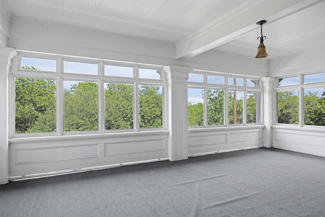501 Branch St, Taylor, TX 76574 - unfurnished sunroom with carpet, beam ceiling, and a decorative wall