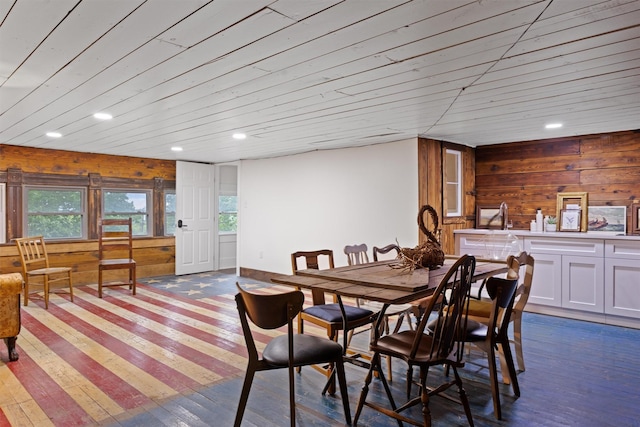 501 Branch St, Taylor, TX 76574 - dining area with hardwood / wood-style floors, recessed lighting, and wooden walls