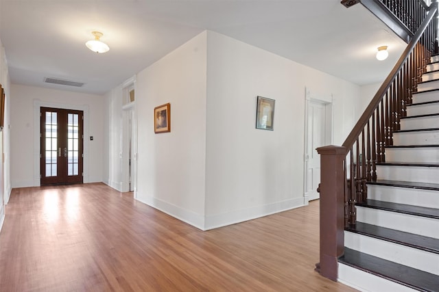 501 Branch St, Taylor, TX 76574 - entryway featuring stairway, light wood finished floors, and french doors
