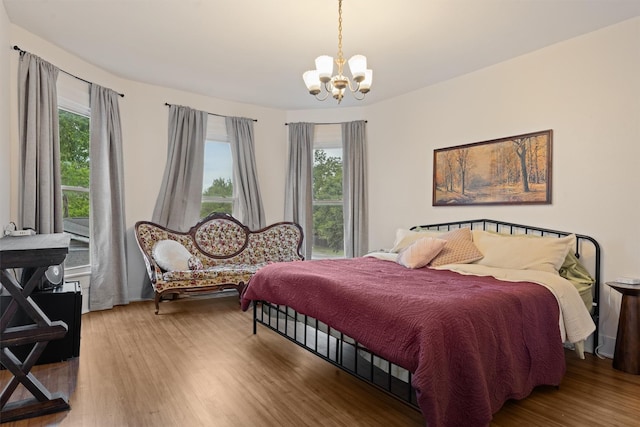 501 Branch St, Taylor, TX 76574 - bedroom featuring a chandelier, multiple windows, and wood finished floors