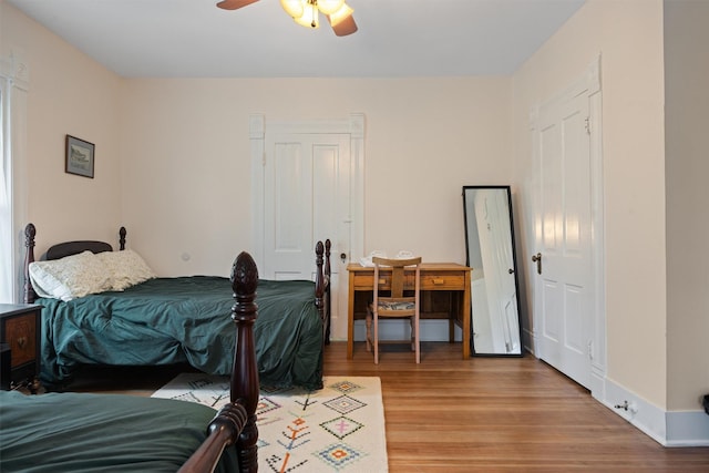 501 Branch St, Taylor, TX 76574 - bedroom featuring wood finished floors and a ceiling fan