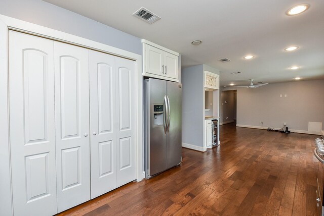 5815 Dryad Dr, Houston, TX 77035 - kitchen featuring stainless steel fridge with ice dispenser, recessed lighting, dark wood finished floors, white cabinets, and wine cooler